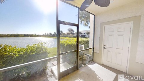 A sunny day with a view of a body of water from a patio.