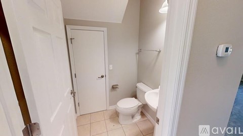 A small bathroom with a toilet and a bidet.
