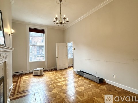 A room with a desk and a bed in it.