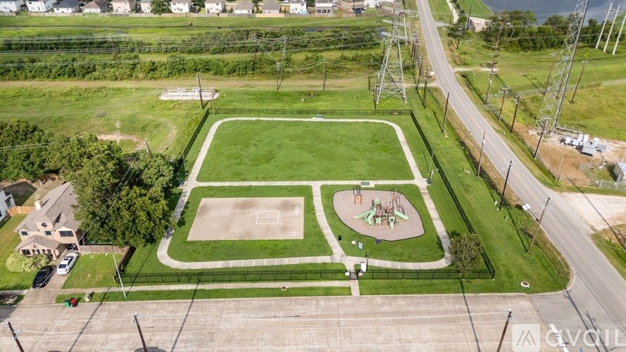 A room with wooden floors and a ceiling fan.