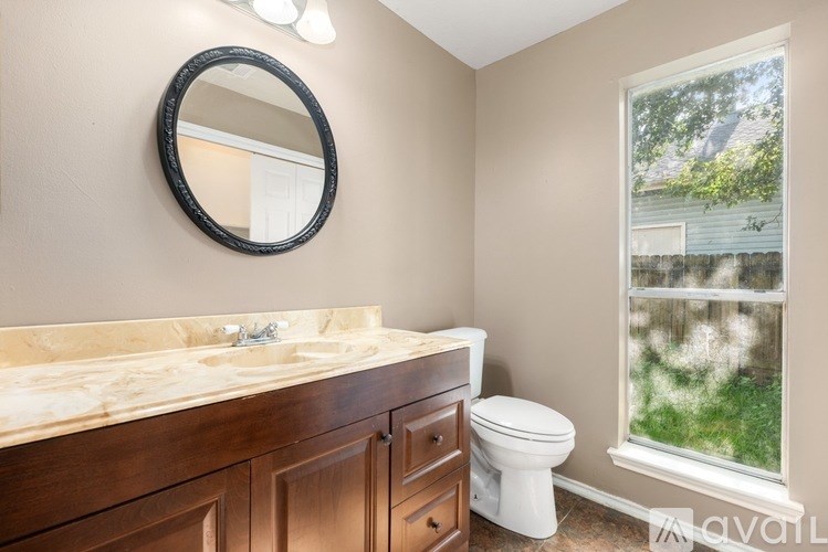 A room with a white door and a tiled floor.