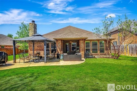 A house with a patio and a hot tub.