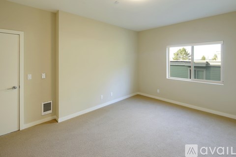 A room with a window and a door.