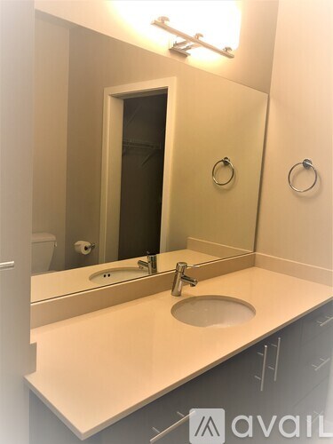 A bathroom with a sink and mirror.