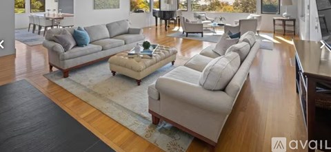 A living room with a large sectional sofa and a coffee table.