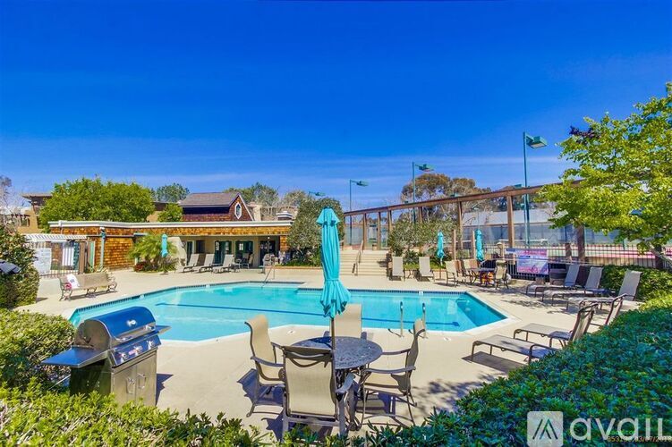 A pool area with chairs and umbrellas is available for rent.