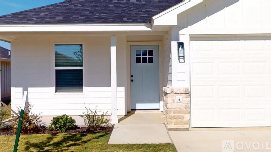 A white closet with a grey floor.