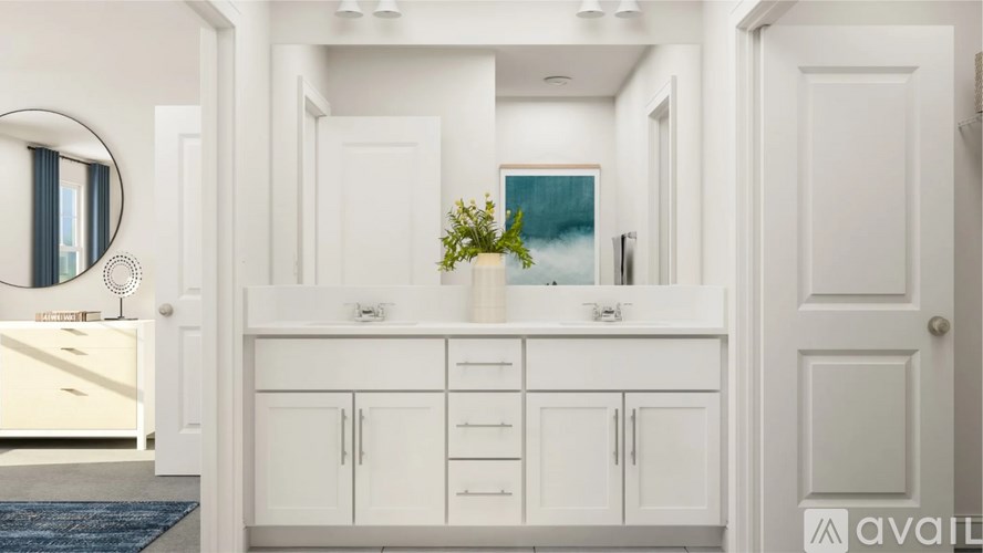 A bathroom with a white cabinet and a mirror on the wall.