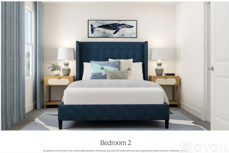 A bedroom with a large bed and two nightstands.