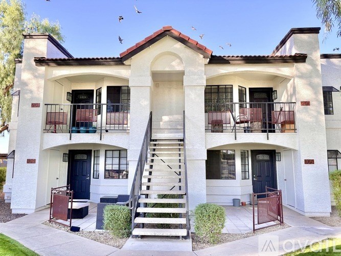 A two-story house with a staircase leading to the second floor.