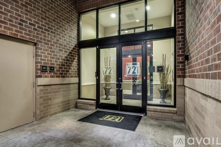 The entrance to a building with a glass door and a sign that reads "1122".