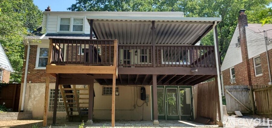 A house with a balcony and a covered patio.