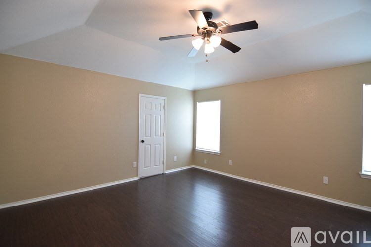 A bathroom with a white toilet, sink, and bathtub.