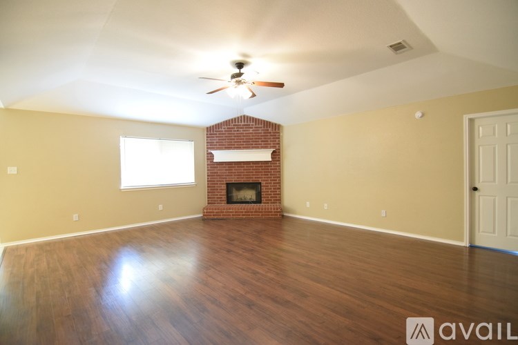 A room with a window and a tiled floor.