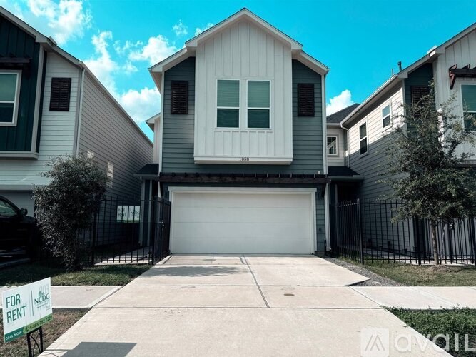 A house with a garage is for rent.