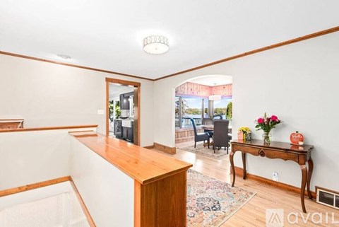 A living room with a wooden table and a sofa.