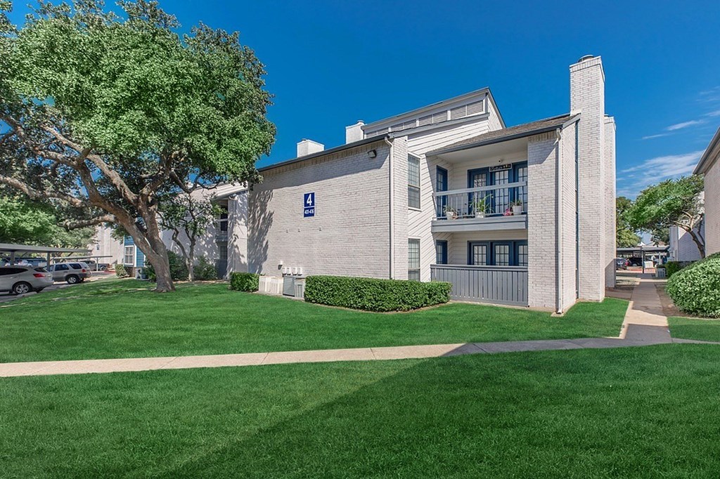A building with a blue handicap sign on the front.