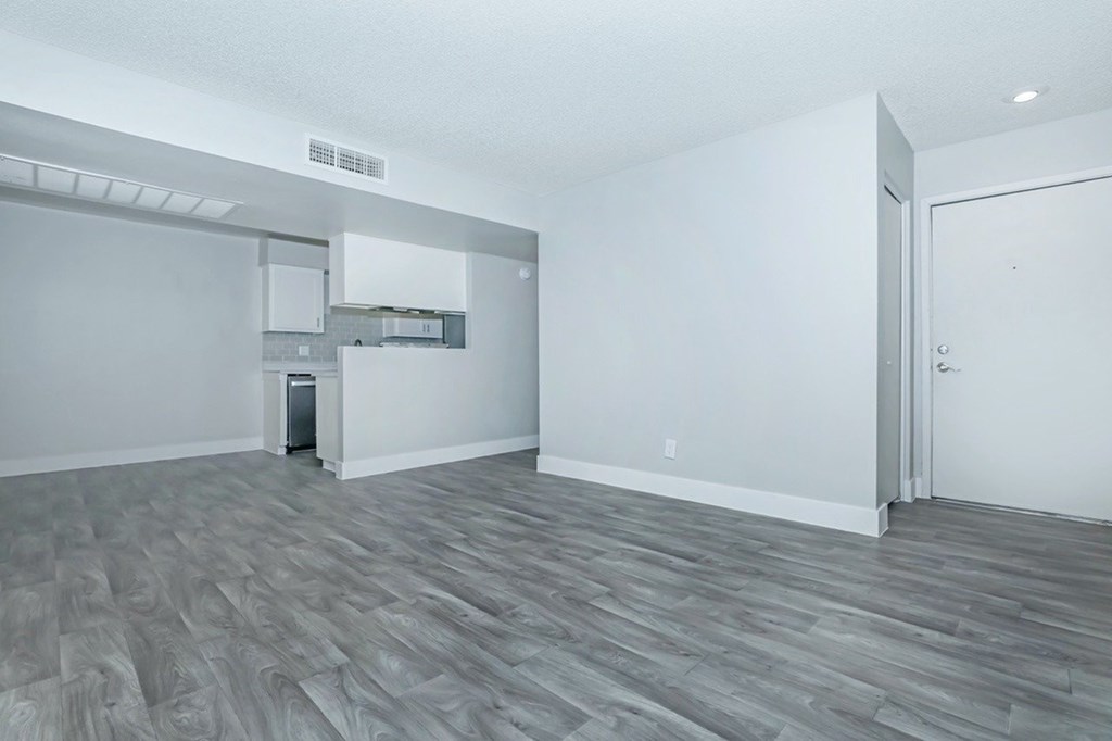 A room with a grey floor and white walls.