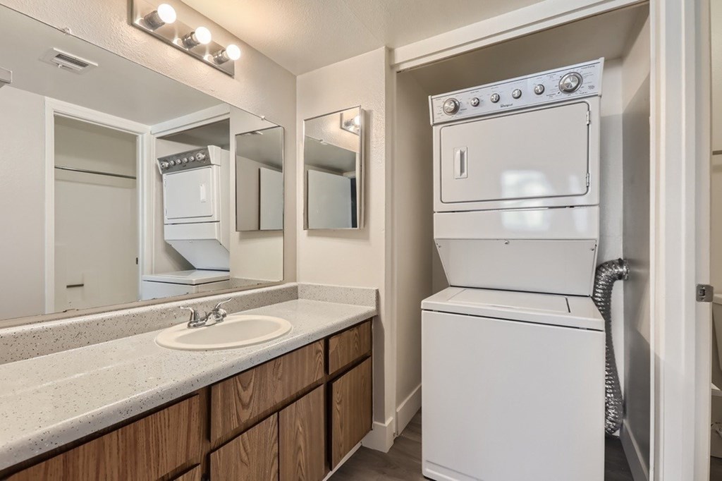 A white oven is in a kitchen next to a sink.