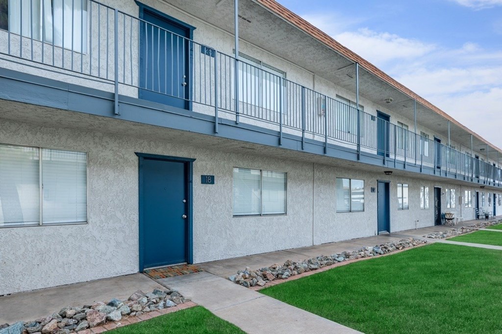 A long building with balconies and doors.