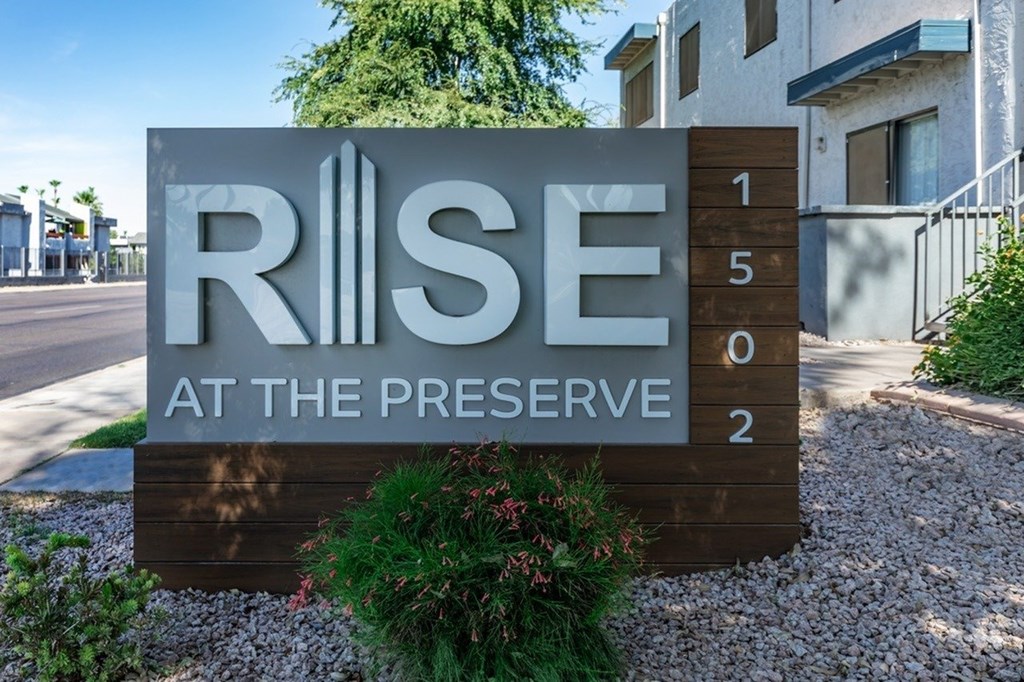 A sign that says RISE at the Preserve with numbers 1, 5, 0, 2 on it.