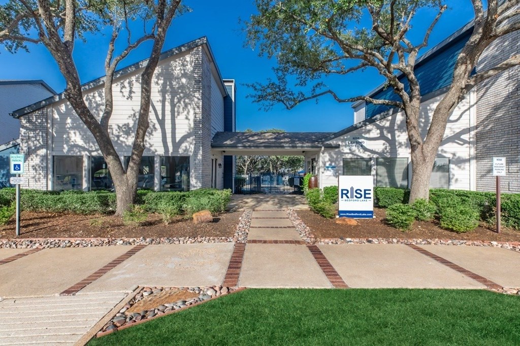 A building with a sign that says RISE in front of it.