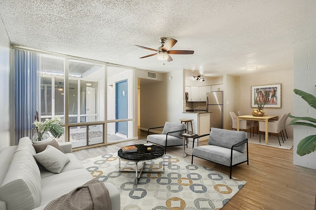 A modern kitchen with a dining table and chairs.