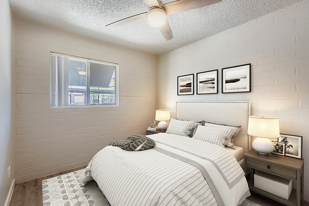 A kitchen with a sink and a stove top oven.