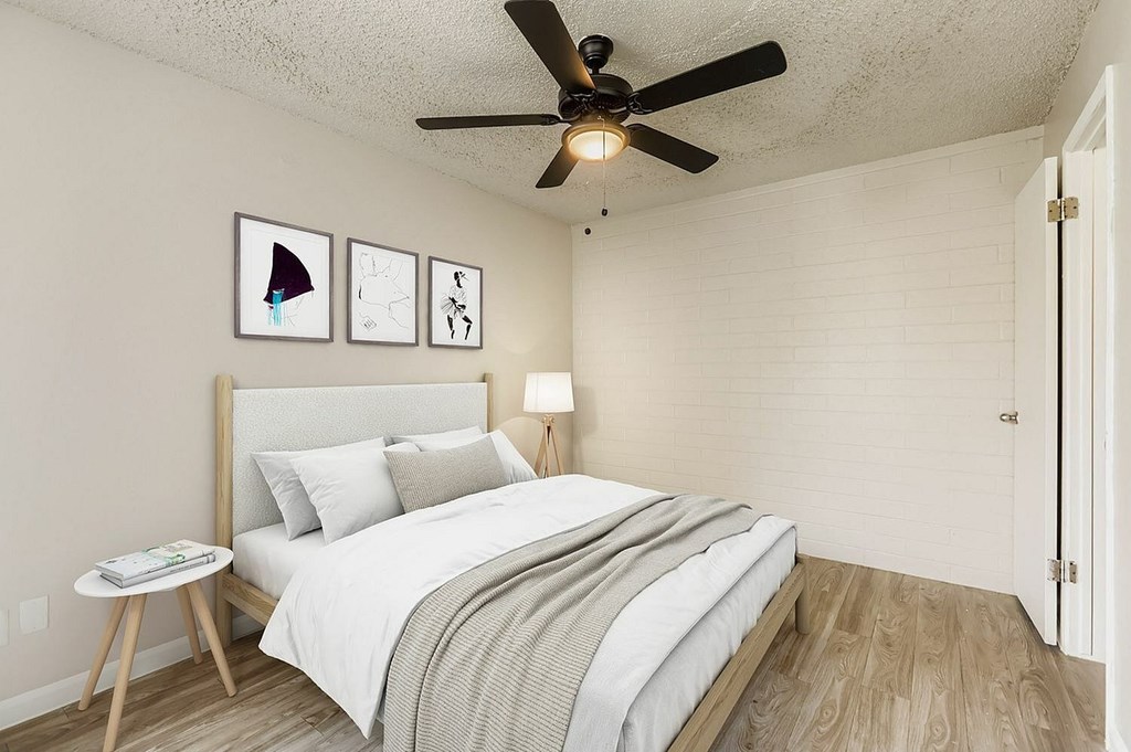 A modern kitchen with a dining table and a couch.