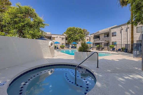 A small pool with a metal railing.