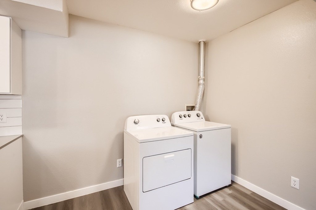 A laundry room with a washer and dryer.