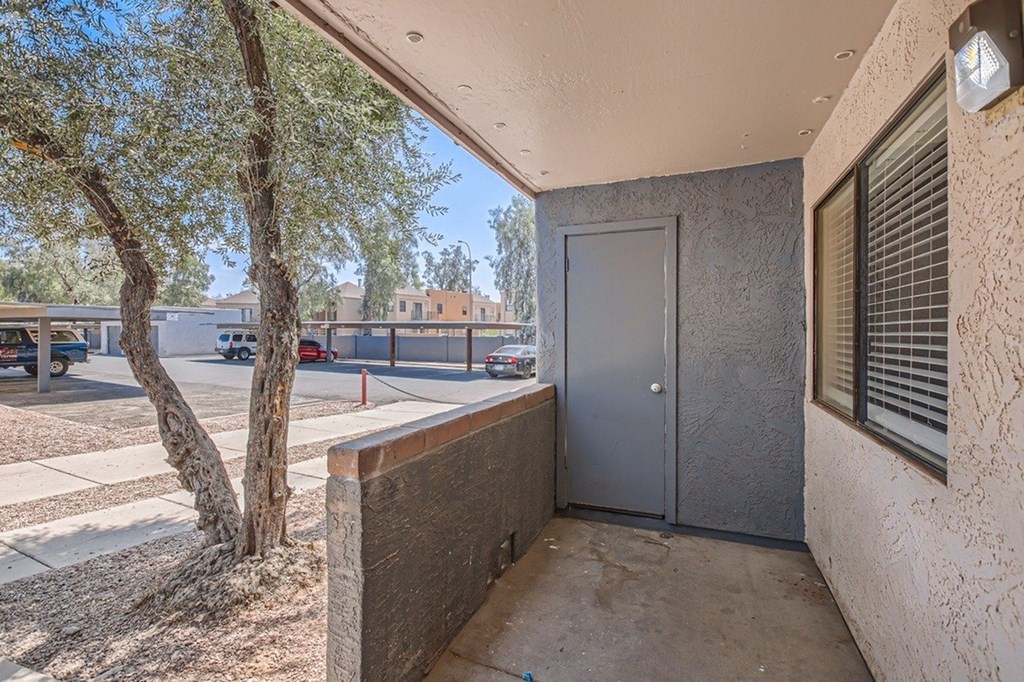 A tree is next to a building.