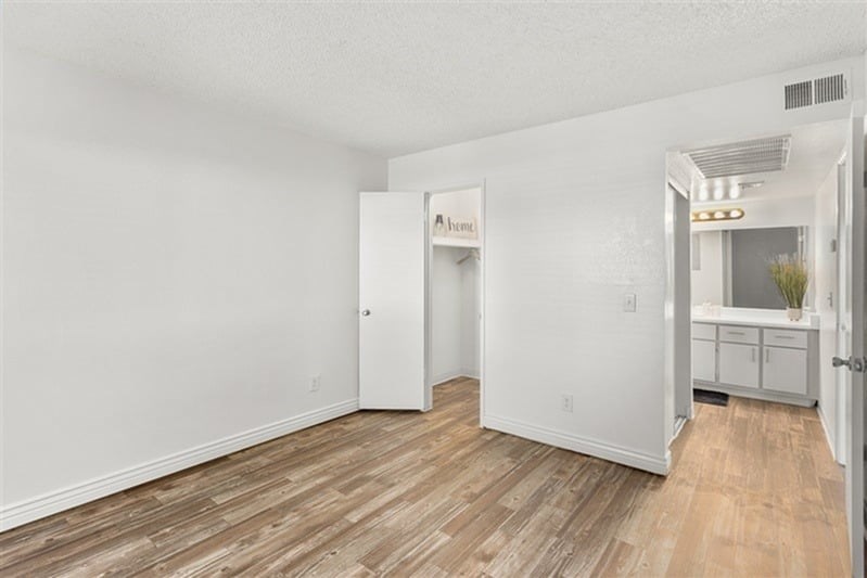 A room with a white door and a sign that says "Amenities" on it.