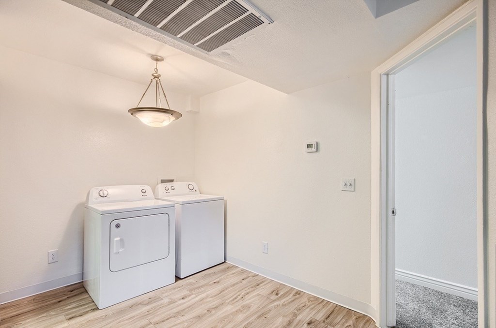 A laundry room with a washer and dryer.