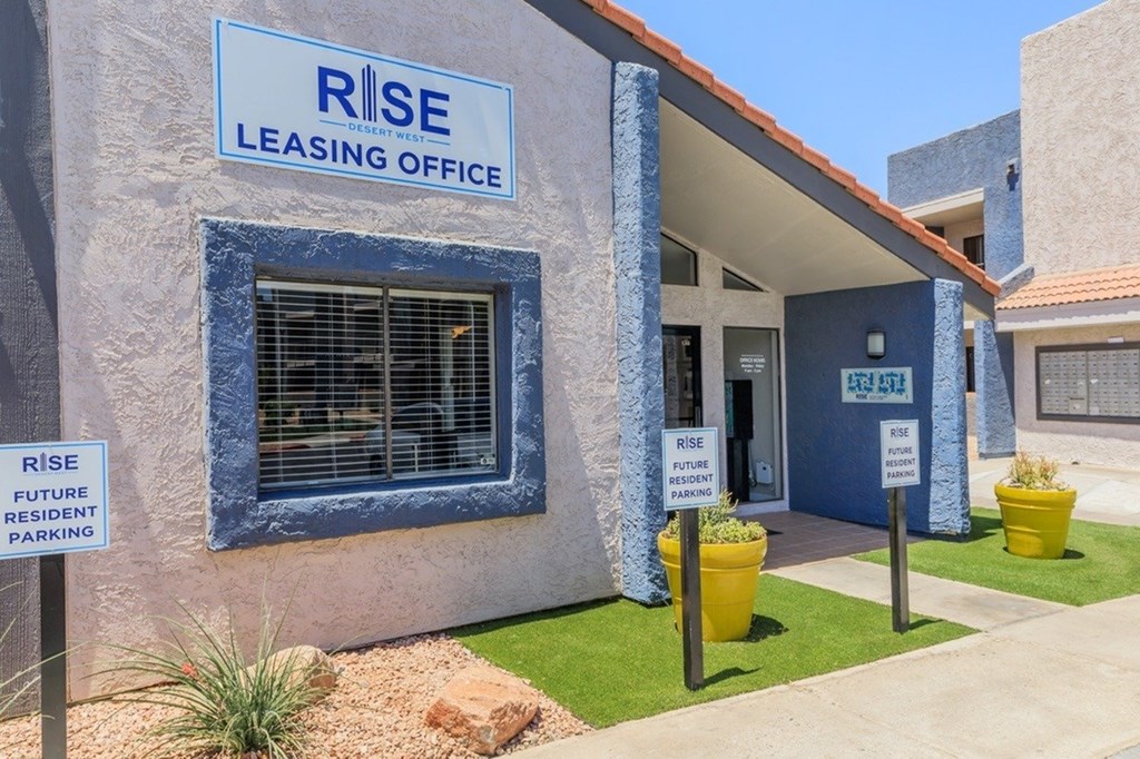 A building with a sign that says RISE LEASING OFFICE.