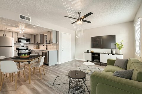 A modern kitchen with a dining table and chairs.