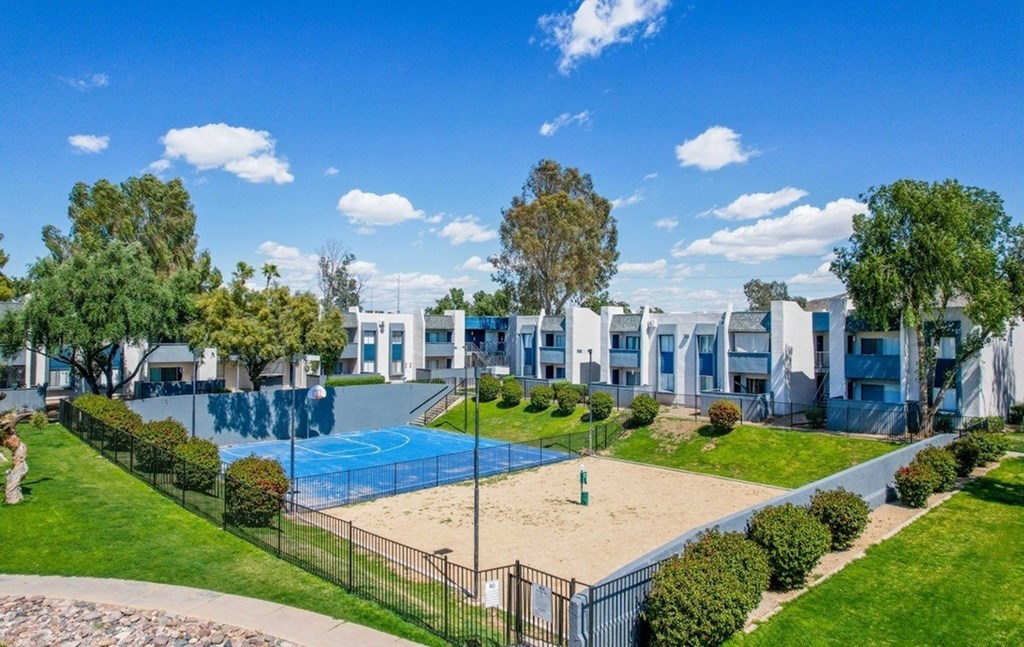 A sunny day at the community pool and sand area.