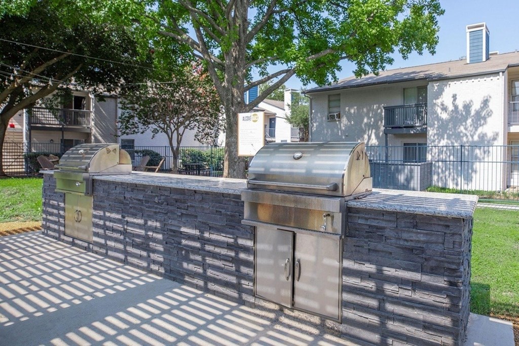 A stone wall with a gate in the middle.