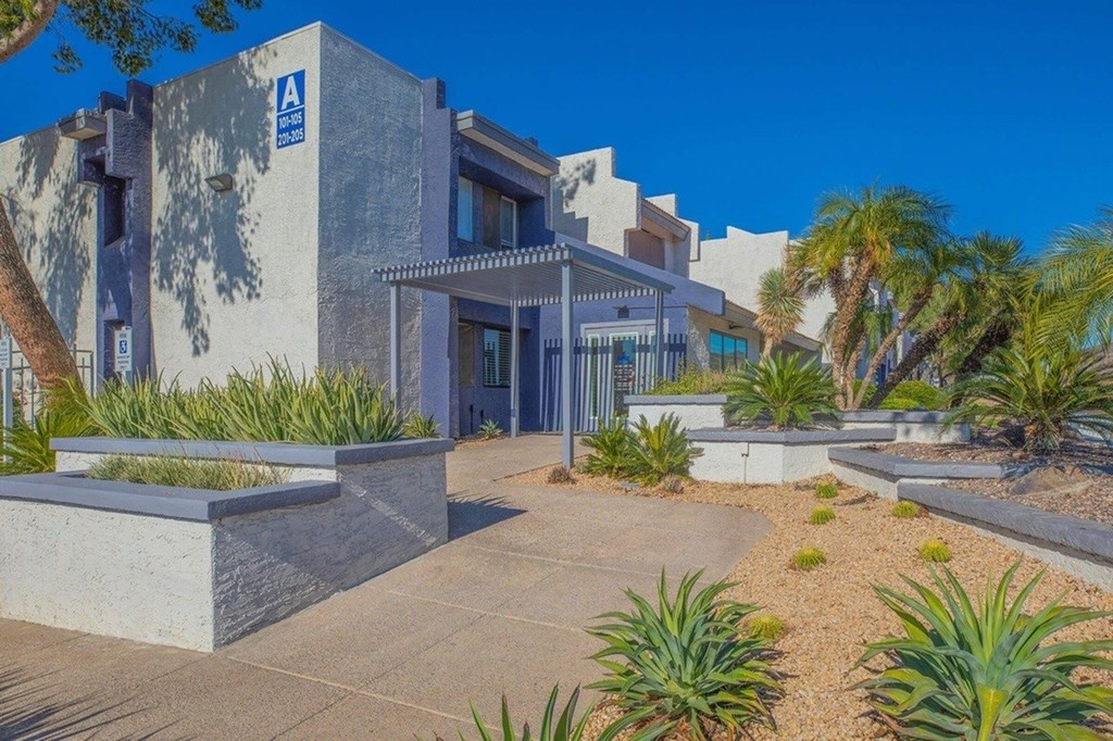 A modern building with a blue sign on the front.