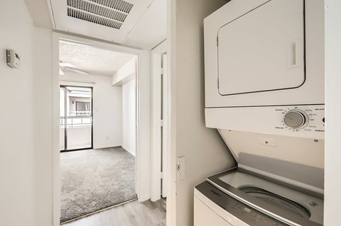 A white oven with a control panel is in a kitchen.