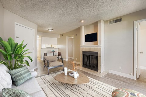 A room with a fireplace and sliding glass doors.