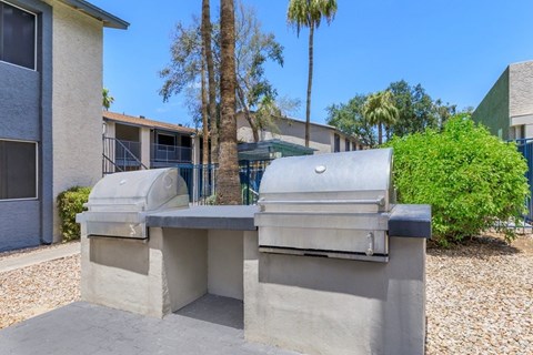 A concrete structure with a tree in the background.
