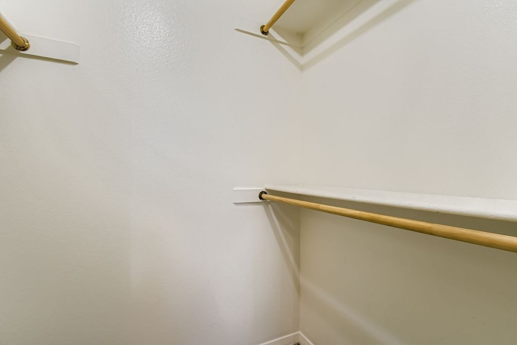 A grassy area in front of apartment buildings.