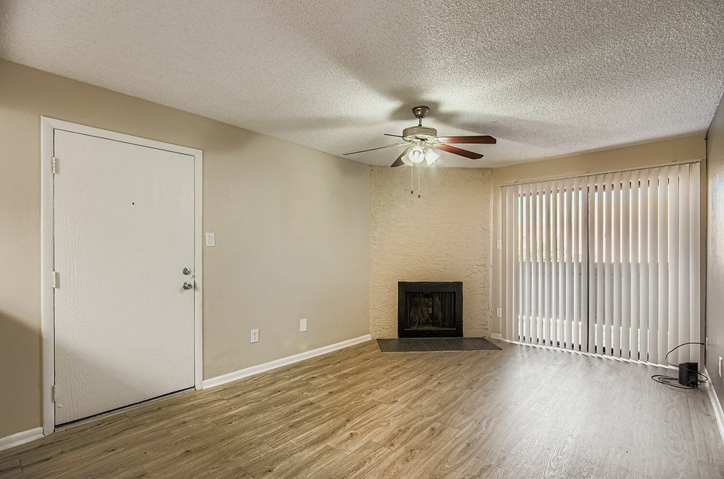 A kitchen with a refrigerator and a counter.