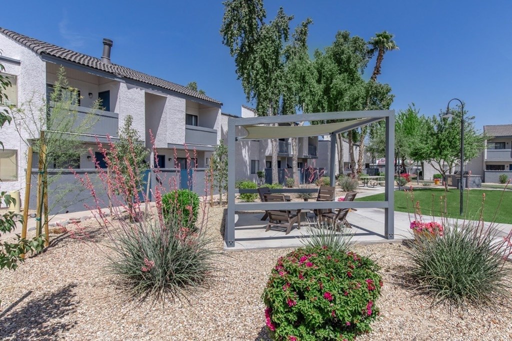 A modern house with a patio and a garden.