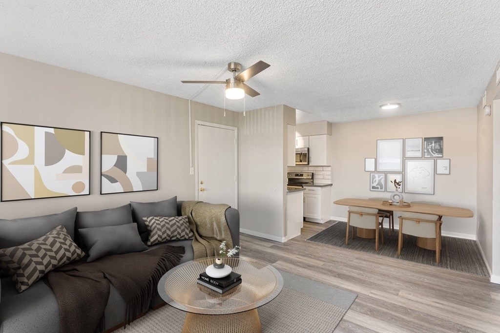 A living room with a grey couch and a coffee table.