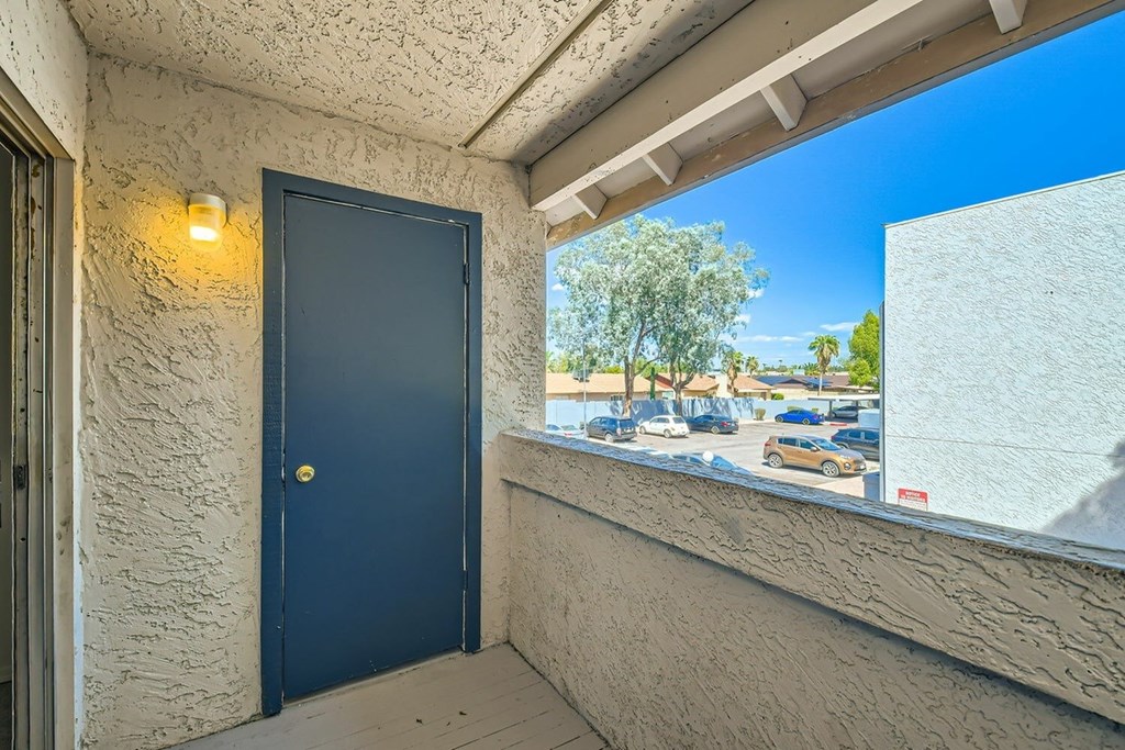 A blue door is on the left side of the image.