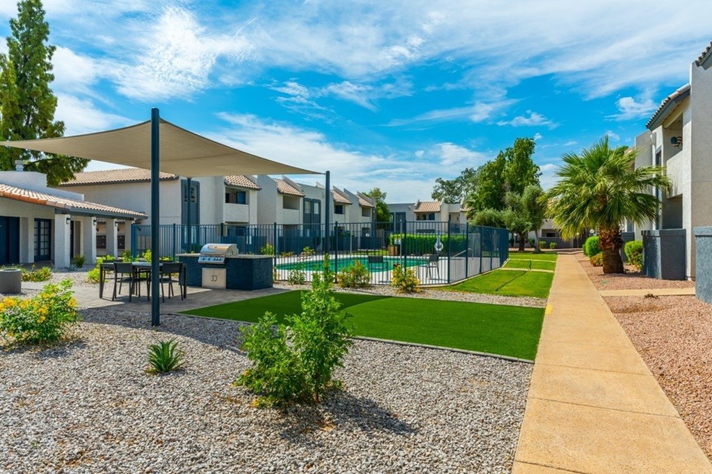 A sunny day at a residential area with houses and a playground.