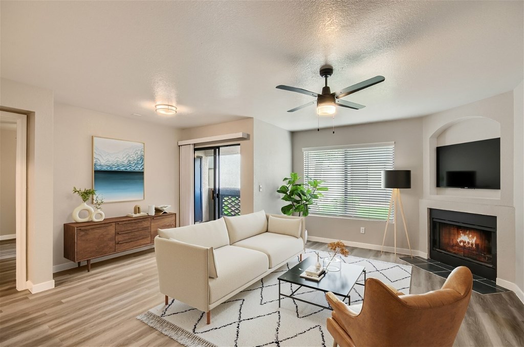 A living room with a fireplace and a couch.