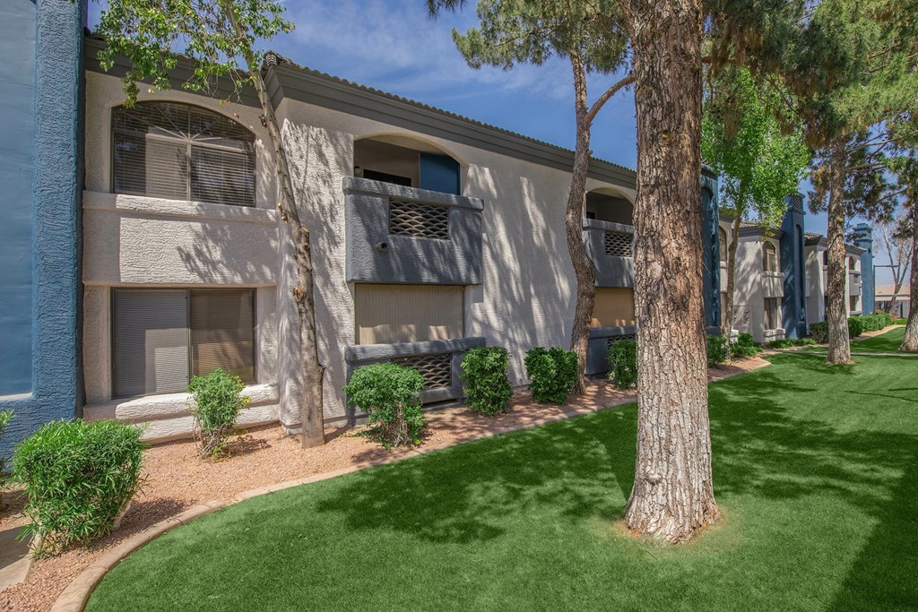 A building with a tree in front of it.